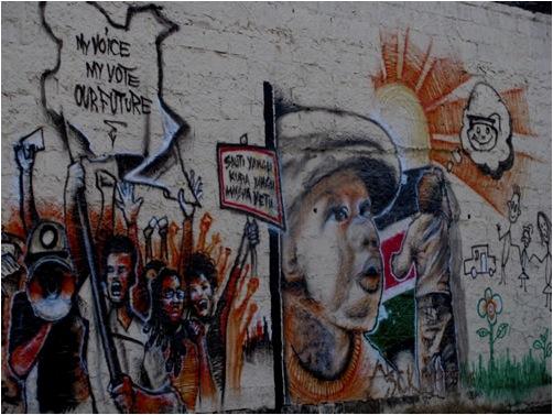 Mural shows people picketing with the text My Voice My Vote our Futures